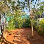 3 BHK Villa In Gondhalpada Alibaug Cozy Bedroom With Sliding Doors And Outdoor View