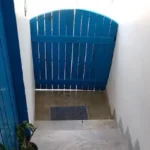 4 BHK Villa Casa De Santorini Varsoli Alibaug Narrow Entry Steps With Blue Gate