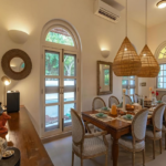 4 BHK Villa Loto Bianco Siolim Goa Dining Area With Pendant Lights