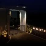45 Saint Hills Riverfront Villas Khanand Karjat 3 BHK Main Entry Gate With Bright Name Sign And Evening Lighting