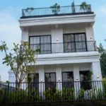 45 Saint Hills Riverfront Villas Khanand Karjat 3 BHK Stylish Exterior Design With Upper Balcony And Green Frontage