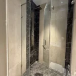 5 BHK Windsor Grande Oshiwara Rental Frameless Glass Shower Bathroom