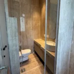 5 BHK Windsor Grande Oshiwara Rental Stone Finish Bathroom
