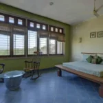 6 BHK Villa Ribandar Panjim North Goa Bedroom With Green Walls Large Windows And Natural Light