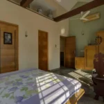 6 BHK Villa Ribandar Panjim North Goa Bedroom With Wooden Doors High Ceiling And Spacious Layout