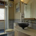 6 BHK Villa Ribandar Panjim North Goa Bathroom With Stylish Sink Mirror And Shower Setup