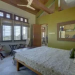 6 BHK Villa Ribandar Panjim North Goa Bedroom With Wooden Ceiling Large Windows And Spacious Layout