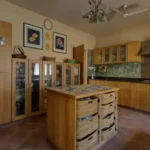 6 BHK Villa Ribandar Panjim North Goa Kitchen With Island Wooden Cabinets Storage And Modern Setup