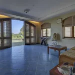 6 BHK Villa Ribandar Panjim North Goa Living Area With Garden View Large Windows Natural Light And Seating