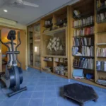 6 BHK Villa Ribandar Panjim North Goa Home Gym And Study Area With Bookshelves Exercise Machine And Storage