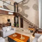 8 BHK Villa Luxe Riviera Candolim Goa Vintage Clock Mural Floating Stair Lantern Grey Living Room