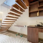 8 BHK Villa Luxe Riviera Candolim Goa Floating Wood Stair Open Shelf Patterned Floor Interior