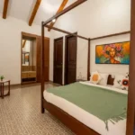 8 BHK Villa Luxe Riviera Candolim Goa Four Poster Floral Art Mirror Patterned Floor Bedroom