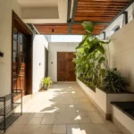 8 BHK Villa Luxe Riviera Candolim Goa Slatted Wood Ceiling Tropical Plant Wood Door Entrance