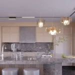 Avant Park West Vile Parle 3 BHK Elegant Modular Kitchen Interior With Marble Island Counter Premium Cabinets And Designer Lights