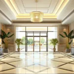 Esquina Link Road Lokhandwala Andheri West Grand Entrance Lobby With Chandelier Marble Flooring And Premium Interiors