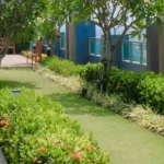 Esquina Link Road Lokhandwala Andheri West Terrace Garden With Trees Pathway Seating And Elevated Outdoor Space