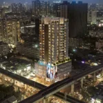 Esquina Link Road Lokhandwala Andheri West Residential Tower Exterior Night View With City Skyline And High Rise Buildings