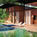 Good Earth Villas Igatpuri Nashik Villa Exterior With Poolside Deck Modern Architecture Glass Facade And Landscaped Surroundings