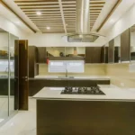 Icon By Merx Jacob Circle Mahalaxmi 3 BHK Kitchen Interior With Modular Island Layout Premium Cabinets