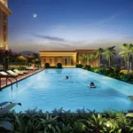 Lakhani Empire Dynasty Panch Pakhadi Thane Premium Swimming Pool Amenity With Landscaped Deck Seating And Evening Ambience