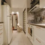 Nirmal CHSL Vile Parle East 3 BHK Kitchen With Compact Layout Modular Cabinets And Functional Storage