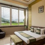 Rishabh Villa Waksai Lonavala 6 BHK Bedroom Interior With Green View Spacious Layout Modern Design Large Windows And Natural Light