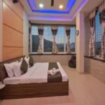 Rishabh Villa Waksai Lonavala 6 BHK Bedroom Interior With Modern Lighting Spacious Layout Large Windows Scenic View And Premium Finishes