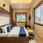 Rishabh Villa Waksai Lonavala 6 BHK Bedroom Interior With Spacious Layout Large Window View Modern Design Comfortable Bedding And Natural Light