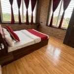 Rishabh Villa Waksai Lonavala 6 BHK Bedroom Interior With Wooden Flooring Modern Design Spacious Layout Large Windows And Natural Lighting