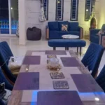 Rishabh Villa Waksai Lonavala 6 BHK Dining Living Area With Spacious Layout Luxury Seating Modern Furniture Elegant Decor And Ambient Lighting