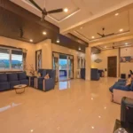 Rishabh Villa Waksai Lonavala 6 BHK Large Living Hall With Open Layout Premium Interior Design Spacious Seating Modern Ceiling And Elegant Decor