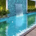 Romell Ariana IC Colony Borivali West Swimming Pool With Waterfall Feature Wooden Deck And Greenery