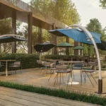 Runwal One Ghodbunder Road Thane West Outdoor Seating Area With Umbrellas Deck And Relaxation Space