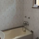 Saudades Beach Bungalow Candolim Goa 3 BHK White Tile Bathtub Shower Classic Bathroom