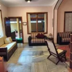 Saudades Beach Bungalow Candolim Goa 3 BHK Wood Trim Striped Sofa Living Room