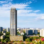 StarOm Ekya Marve Road Malad West High Rise Tower Exterior With City Skyline And Surrounding Buildings