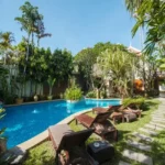 The Chapter Vaijali Alibaug Private Garden With Swimming Pool Stone Pathway And Tropical Greenery