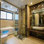 Viyaara Altiora Shivaji Park Dadar 2 BHK Bathroom With Marble Finish Glass Shower Bathtub And Vanity Counter
