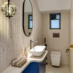 3 BHK Bungalow Green Garden Chembur Mumbai Compact Bathroom Interior With Wall Mounted Sink Mirror Toilet Small Window And Minimal Layout