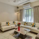 3 BHK Bungalow Green Garden Chembur Mumbai Living Room With Large Sofa Seating Center Table Window Curtains