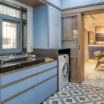 3 BHK Bungalow Green Garden Chembur Mumbai Utility Kitchen Area With Countertop Washing Machine Sink Window And Pattern Floor Tiles