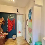 3 BHK Imperial Heights Goregaon West Carved Wood Temple Devi Signage Teal Accent Wall Buddha Art Pooja Room