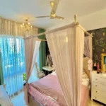 3 BHK Imperial Heights Goregaon West Pink Four Poster Canopy Bed Botanical Wallpaper Green Curtain Crystal Chandelier Bedroom