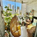 3 BHK Imperial Heights Goregaon West Rattan Hanging Egg Chair Dense Potted Plant Cityview Bohemian Balcony