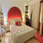 3 BHK Imperial Heights Goregaon West Red Painted Arch Headboard Block Print Bedsheet Vintage Wardrobe Bedroom