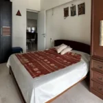 3 BHK Kalpataru Solitaire Juhu Scheme Dark Wood Wardrobe Ethnic Art Wall Bedroom
