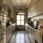 3 BHK Kalpataru Solitaire Juhu Scheme Fridge Beige Cabinet Dark Counter Parallel Layout Kitchen