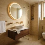 3 BHK Mahindra Rainforest LBS Road Kanjur modern bathroom with round LED mirror and glass shower partition