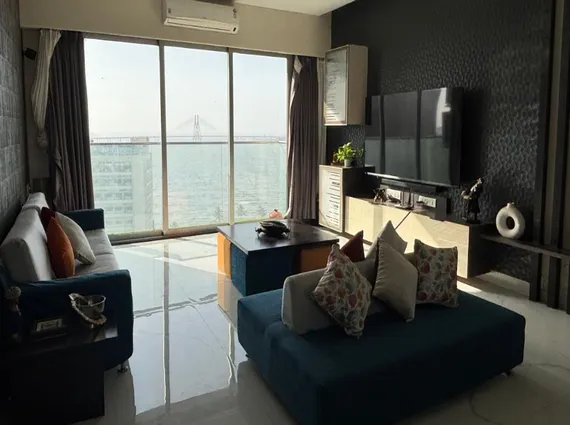 3 BHK Tranquil Bay Prabhadevi Teal Blue Sectional Dark Textured Wall Bandra Worli Sealink View Living Room